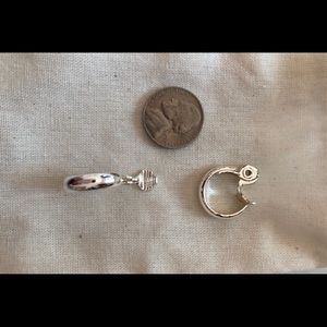 Clips silver tone hoops. Never worn.